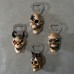 Four three-dimensional skull bottle openers with resin refrigerator stickers and creative bottle openers