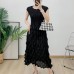 Bubble pleated sleeve cinched waist pleated mid length skirt