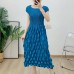 Bubble pleated sleeve cinched waist pleated mid length skirt