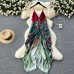 Unique and niche vacation dress with women's design sense, V-neck pleated irregular print, contrasting color vacation flower bud long skirt
