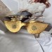 Schiaparelli glasses aesthetic surrealist style exaggerated heavy industry glasses