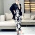 Spring and summer new French end printed fashionable Miyake pleated dress with elegant temperament and loose flesh covering long skirt