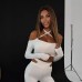 Hanging neck long sleeved top with hollowed out waist and micro flared long pants two-piece set