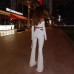 Hanging neck long sleeved top with hollowed out waist and micro flared long pants two-piece set