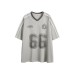 Printed distressed contrasting V-neck design with mesh sports short sleeves