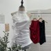 Sleeveless ruffled three-dimensional flower top