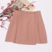 Irregular high waisted pleated anti glare short skirt with hip coverage