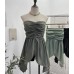 Sleeveless top with strapless folds waist cinching and slit design