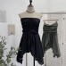 Sleeveless top with strapless folds waist cinching and slit design