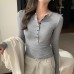 Half open collar long sleeved top with buttons