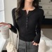 Half open collar long sleeved top with buttons