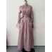 Dress design with a cinched waist and long sleeves