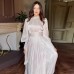 Dress design with a cinched waist and long sleeves