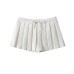 Short skirt with bottom pants and bow tie at waist