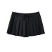 Short skirt with bottom pants and bow tie at waist