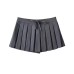 Short skirt with bottom pants and bow tie at waist