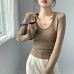 U-neck long sleeved waist cinching slim fit top
