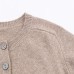 Long sleeved single breasted solid color knitted sweater for women