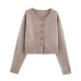 Long sleeved single breasted solid color knitted sweater for women