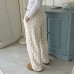 Double sided plush knitted pants with floral patterns