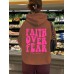 Hooded long sleeved fleece sweatshirt with Faith Over Fear print