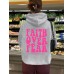 Hooded long sleeved fleece sweatshirt with Faith Over Fear print