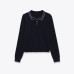 Color blocked short sleeved polo knit top with stitching