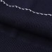 Color blocked short sleeved polo knit top with stitching