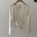 Pattern Type Solid Color  Sleeve Length Long Sleeve  Neckline Cross V-Neck  Detail Pleated Irregular Hem  Fit TypeSlim Fit  Occasion  ClothingTops