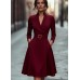 Solid color waist cinched V-neck long sleeved dress with large swing