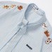 Embroidered vertical striped short sleeved shirt