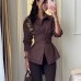 Waist tied solid color long sleeved shirt