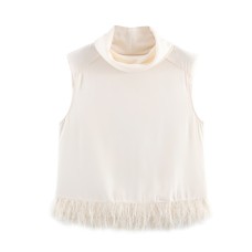 Commuter style design with tassel embellishment shoulder pad top