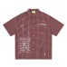 Grid patterned splashed ink text short sleeved shirt