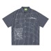Grid patterned splashed ink text short sleeved shirt